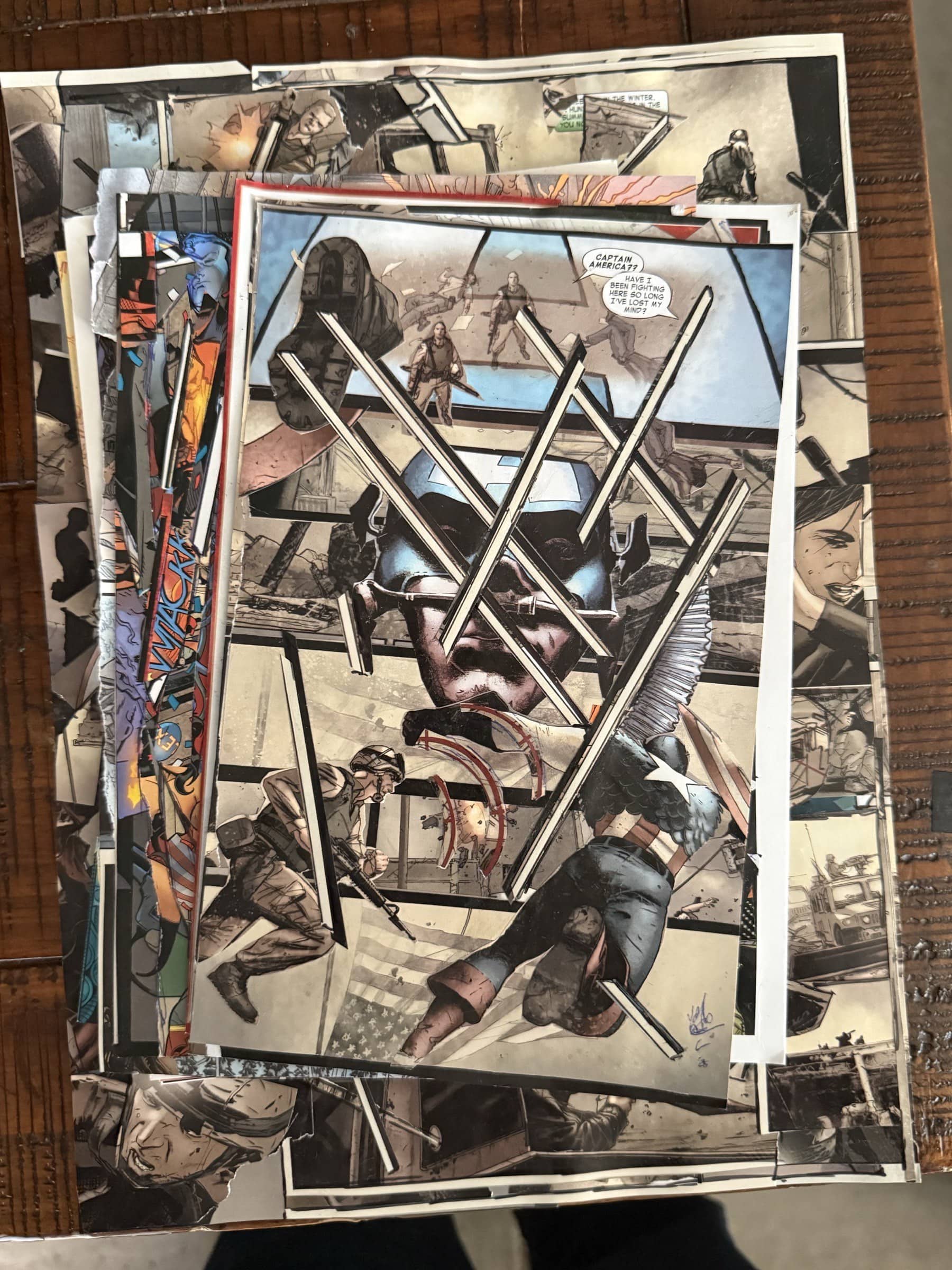 Stacked collage fragments on the garage table with a central Captain America surface held over a larger field of fractured war imagery.