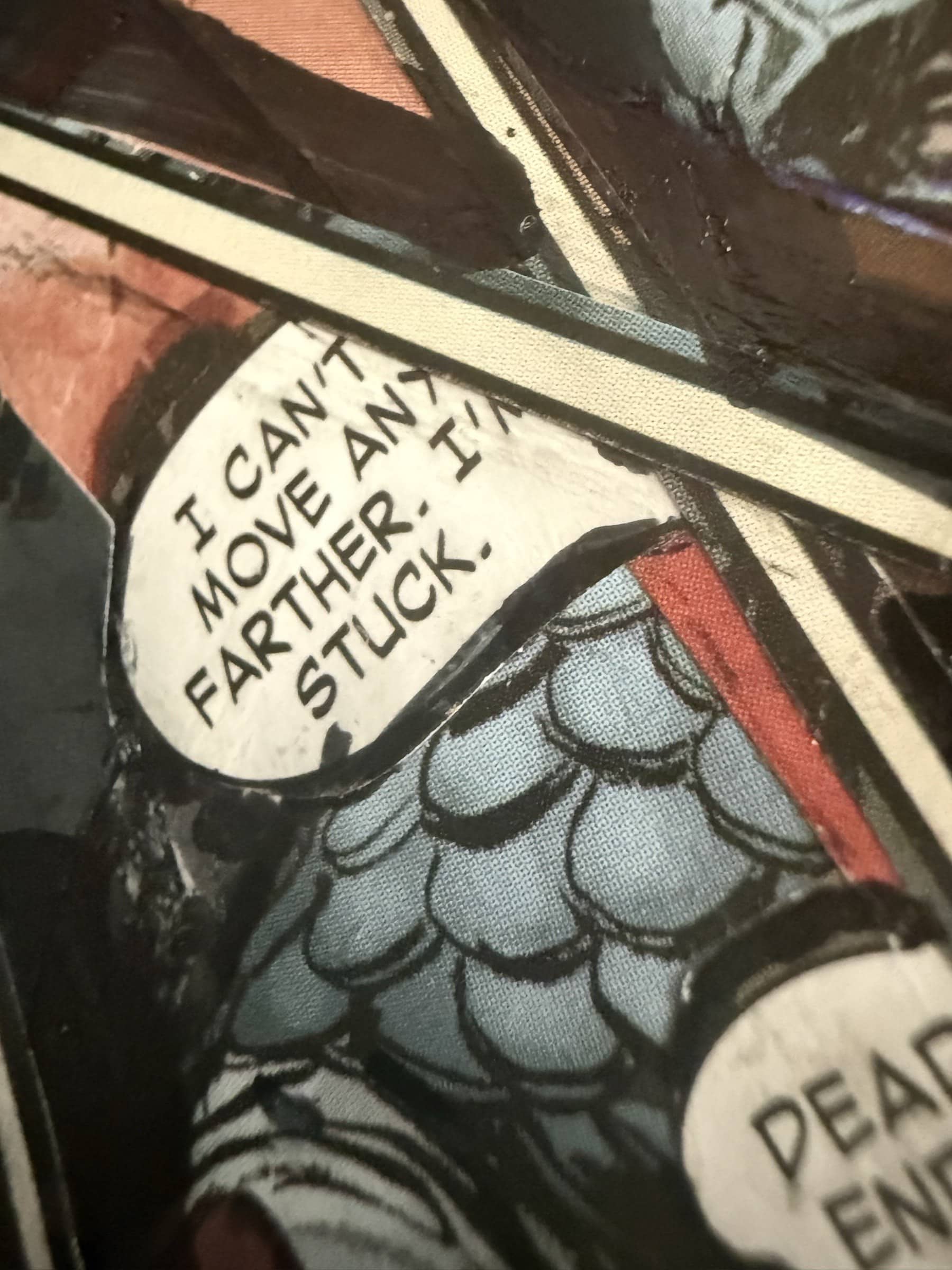 Close-up of a speech bubble fragment reading I CAN'T MOVE ANY FURTHER. I'M STUCK.