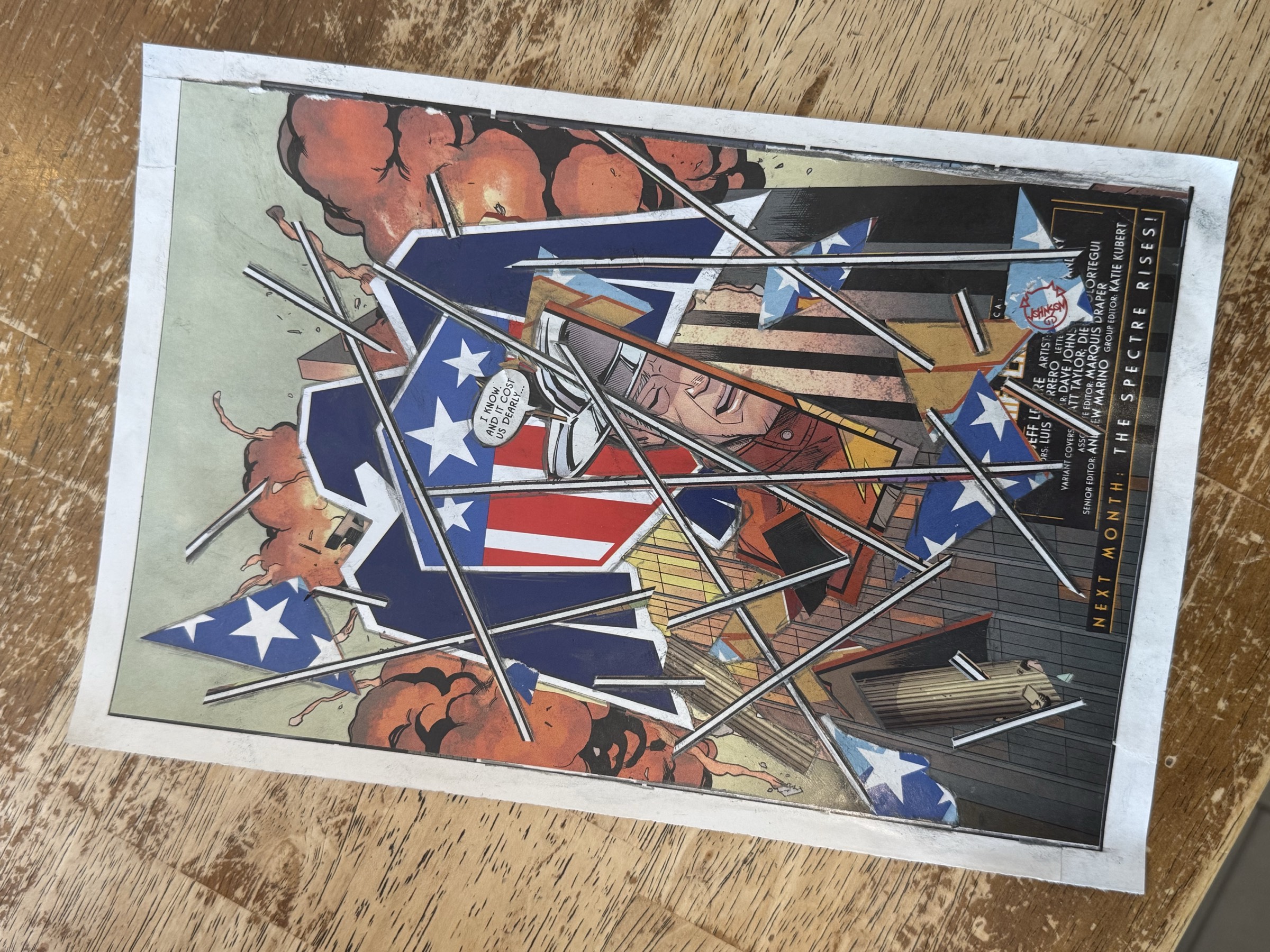 Studio process capture of the completed collage on table surface before final framing decisions.