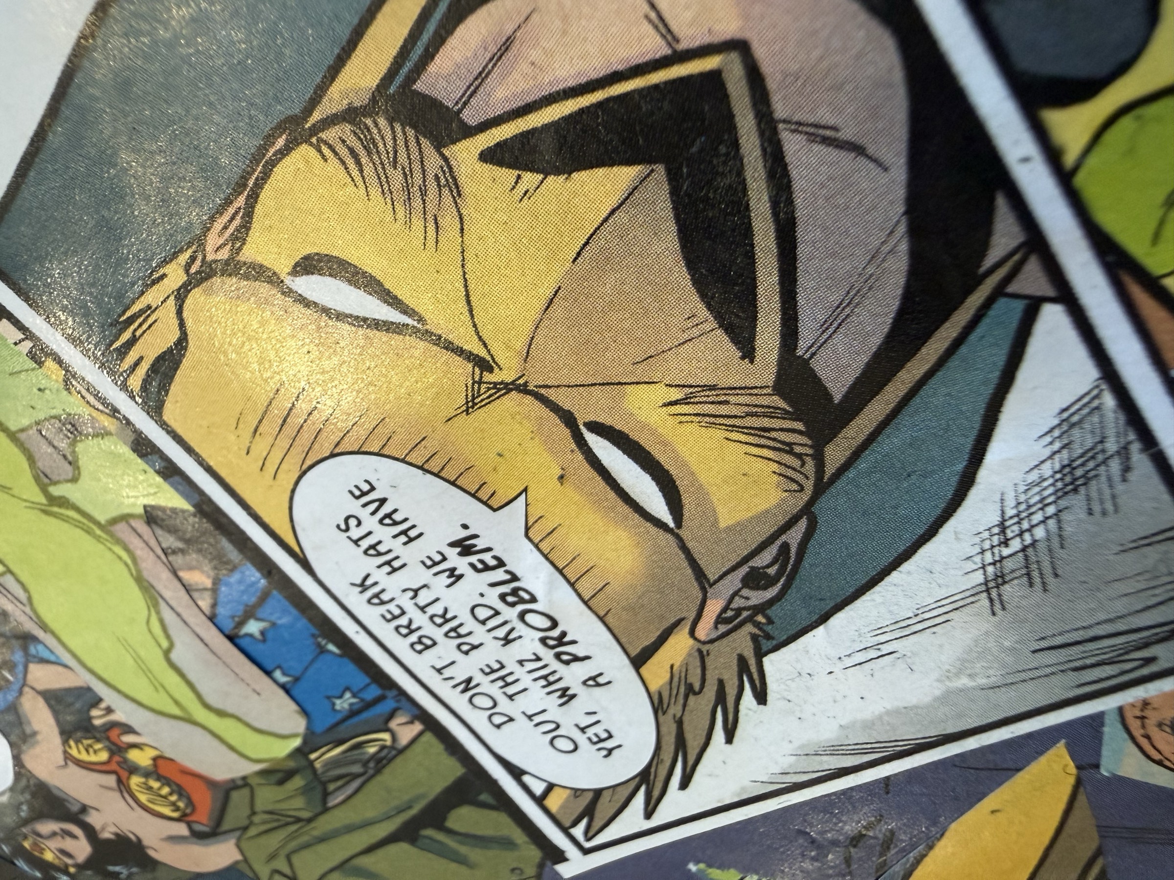 Secondary view of layered comic panel fragments and torn joins.