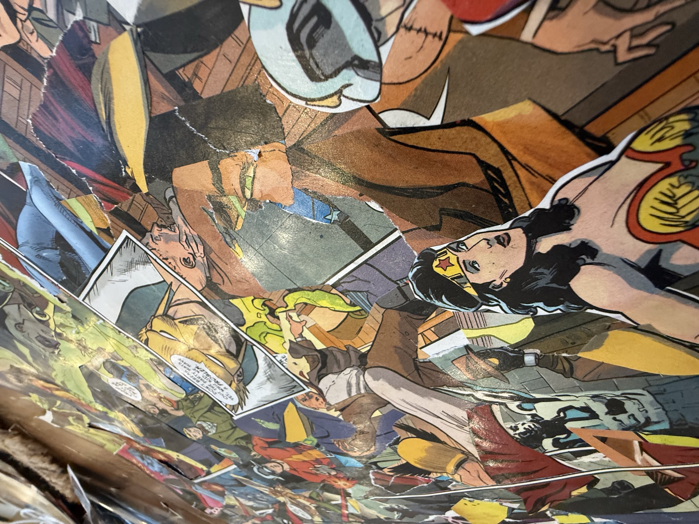 Detail view of layered comic geometry and adhesive seams.