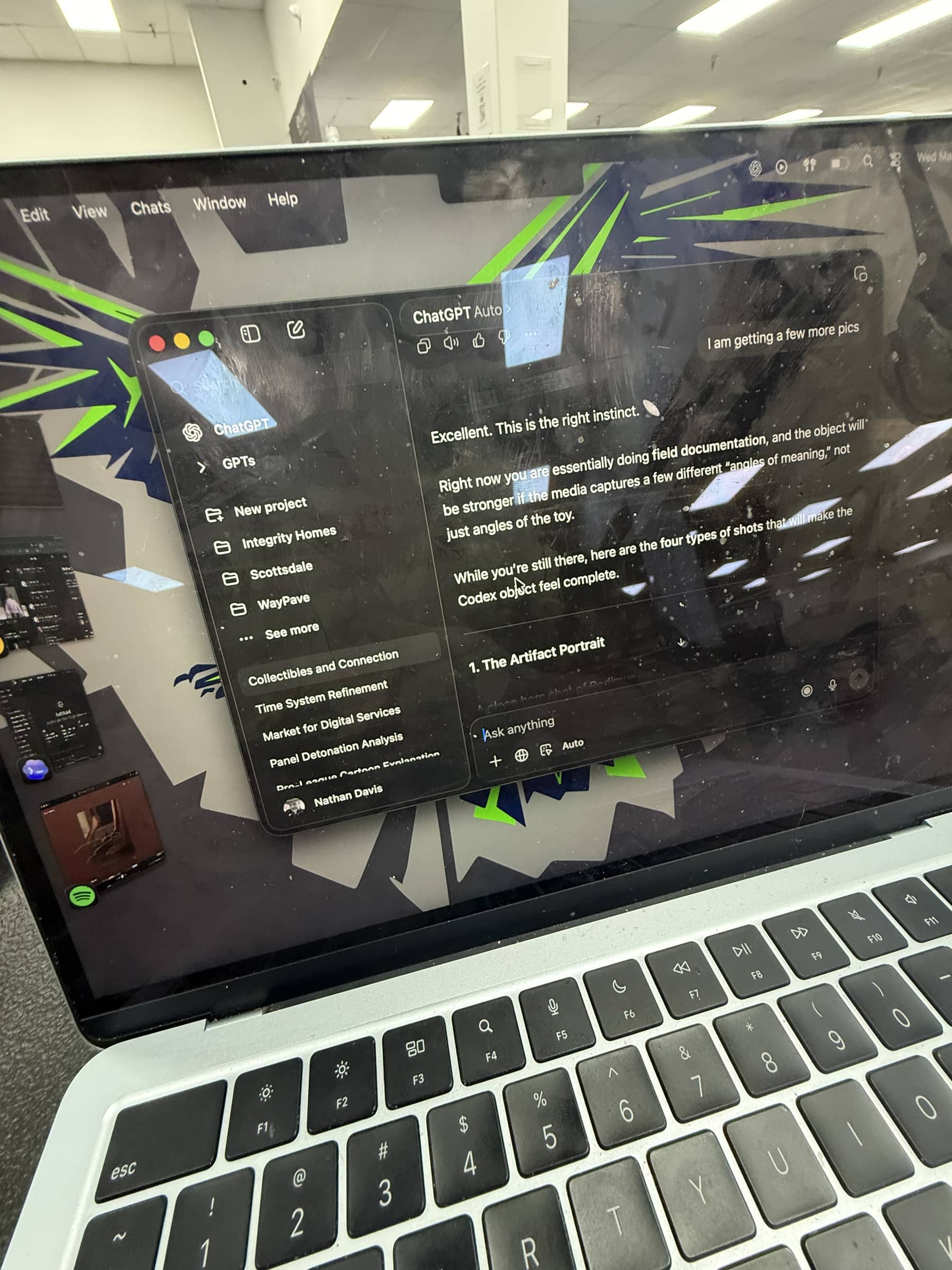 Laptop screen showing the Codex interface open during the Charlie's Collectibles visit.