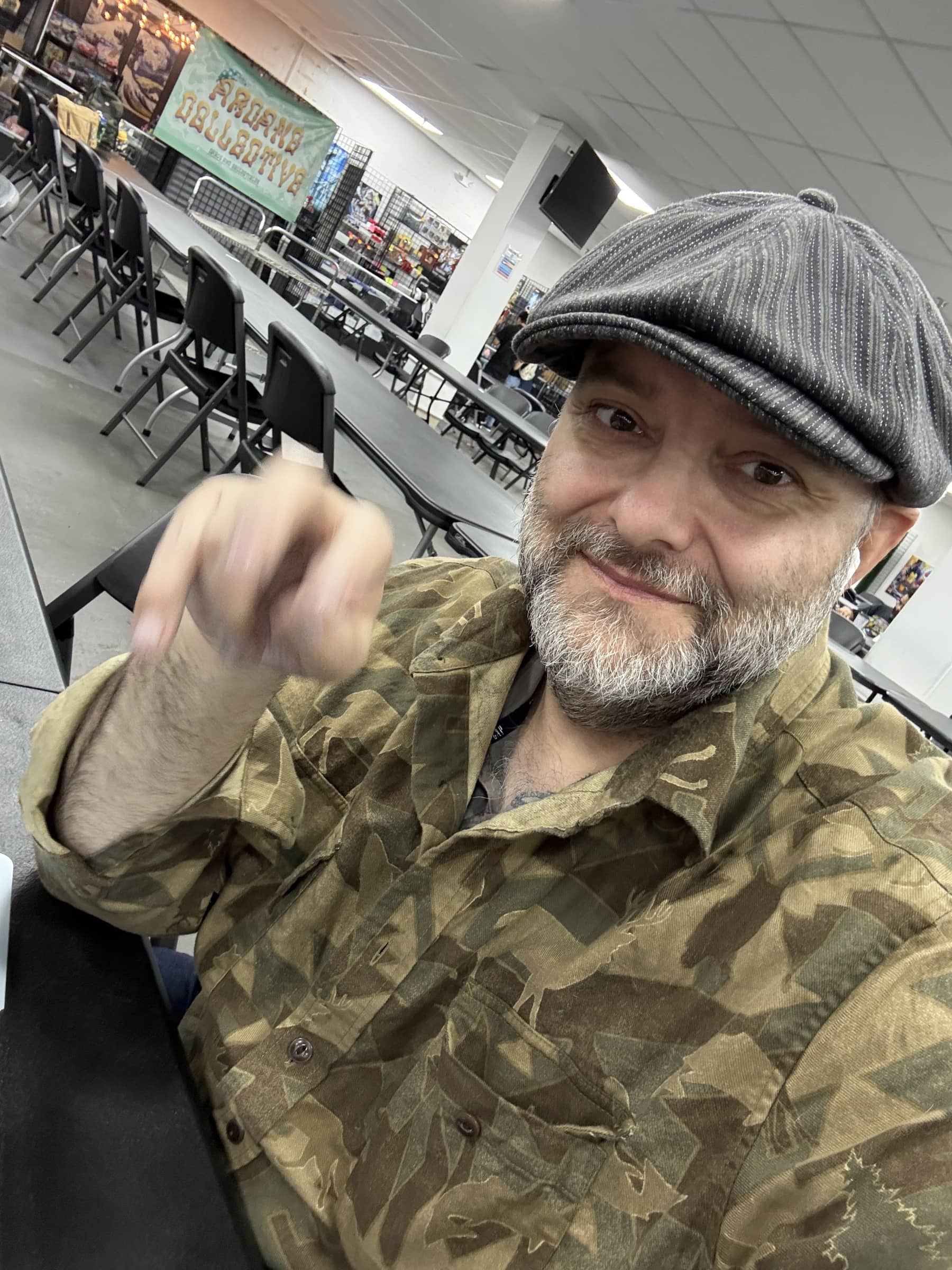 Operator portrait captured inside Charlie's Collectibles during the field visit.