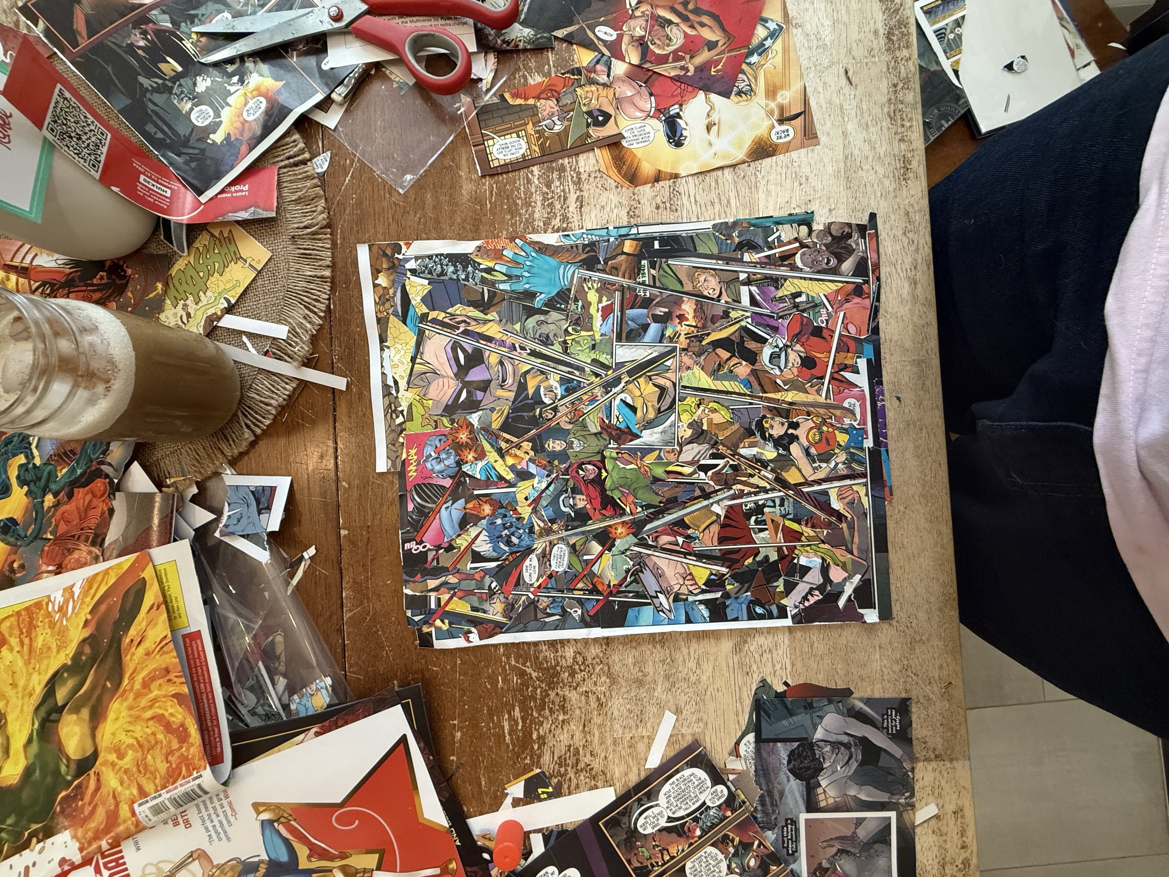 Closer overhead view showing thin bar-like paper fragments tightening the central collision field.